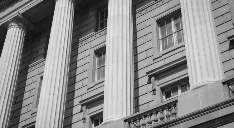 Pillars of law at a federal court house.